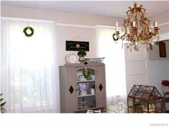 Beautiful chandelier in the dining room, wood floo