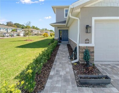Pavers lead you to front entrance.