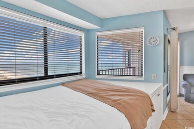 Bedroom featuring light tile patterned floors and 