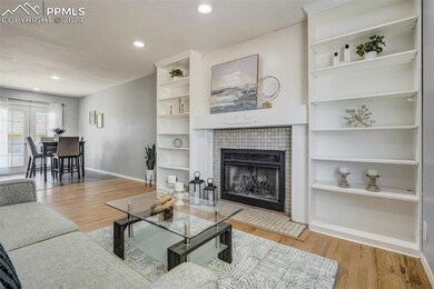 Living room with light hardwood / wood-style floor