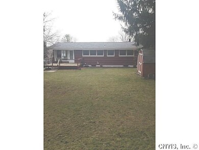 Exterior Back. Level, fenced in back yard with dec