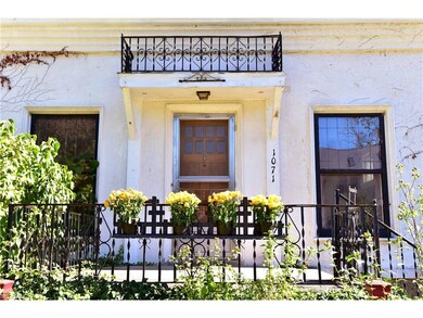 Enchanting front elevation . . . recessed windows, notable trimwork, generously sized front porch, timeless stucco exterior . . . this is an architectural gem that is ready to forged anew!
