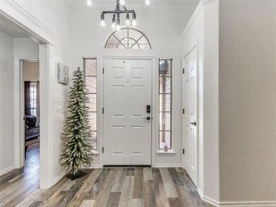 Entryway featuring a notable chandelier, ornamenta