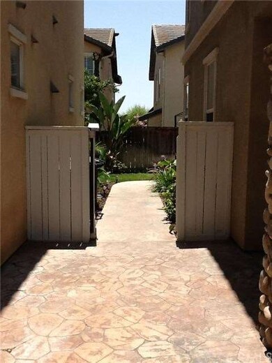 view of front courtyard leading to back yard.