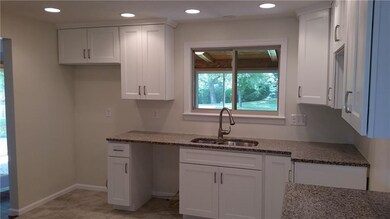 Ceramic tiled floor eat-in-kitchen with soft close