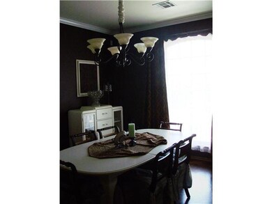 Dining Room. Rich colored walls and stained concre