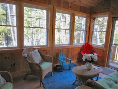 An enclosed porch with water views...