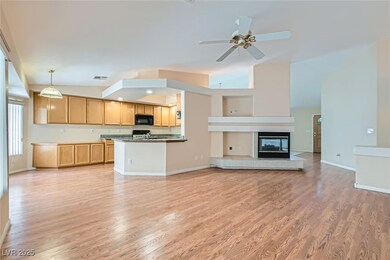 Kitchen with black microwave, visible vents, open