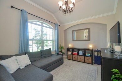 This room just off entrance traditional used as a formal dining now used as extra living room.