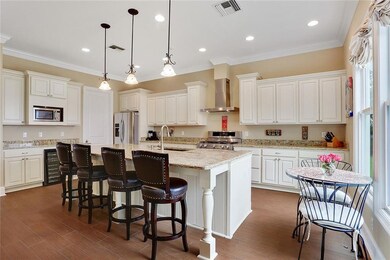 Close-up of large gourmet eat-in- kitchen. Door ne