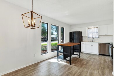 The equally spacious kitchen boasts a breakfast ar