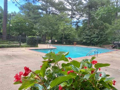 Community Pool with lovely flowers all around