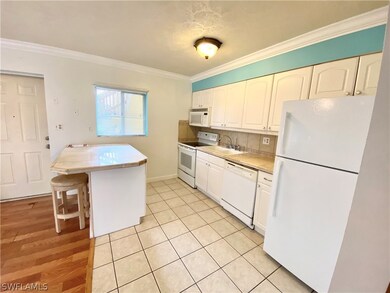 Kitchen peninsula which oversees main living space. Both kitchen and living room are generously proportioned.