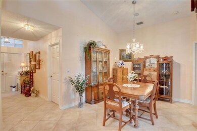 True foyer with double door entry, neutral stone-l