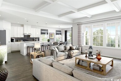 Living area with beam ceiling, coffered ceiling, dark wood finished floors, and ornamental molding
