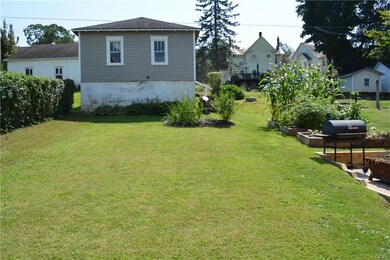 Back yard and view of garage