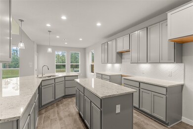 This kitchen is by far any chef’s dream! This spacious kitchen features high ceilings, cool stained wood cabinets, granite countertops, SS appliances, modern tile backsplash, recessed lighting with additional custom pendant lighting, extended counter space, granite kitchen island with double sink and space for breakfast bar, and a walk-in pantry all overlooking your huge family room.
