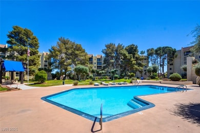 Community pool with a patio area