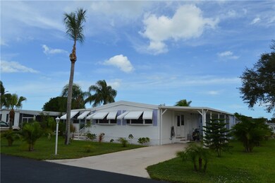 FRONT OF HOME WITH NICE DRIVEWAY & CARPORT TOO!