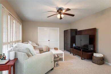 Living room with panel doors to den/office