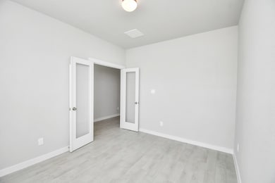 Step into the inviting home office, where elegant tile flooring adds a touch of freshness and comfort to the workspace. Natural light pours through the window, creating an inspiring environment for productivity and focus. Sample photo of completed home with similar floor plan. Actual colors and selections may vary.
