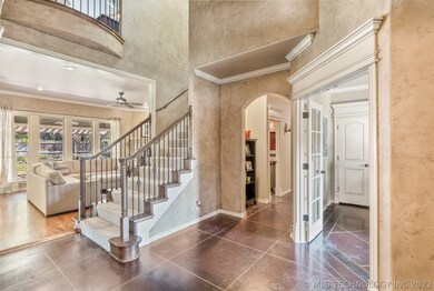 Generous entryway with high ceilings, attractive s