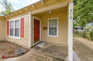 Doorway to property with a patio area