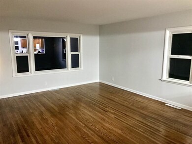 spacious liv rm with beautiful hardwood floors