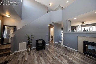 Foyer featuring wood finished floors, baseboards, 