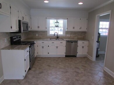 Your Dream Kitchen! Complete with granite and tile back splash. 