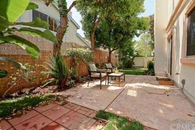 Landscaped patio and yard with lovely garden. 