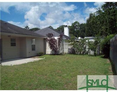 Exterior Back. Privacy Fence, Patio with Covered A