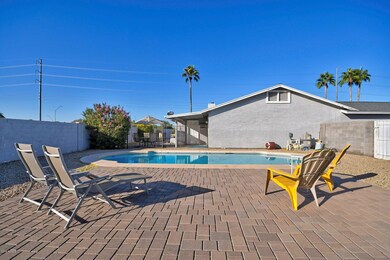 Pavered patio surrounds POOL