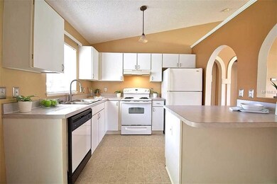 Kitchen with ample cabinet storage & counter workspace!