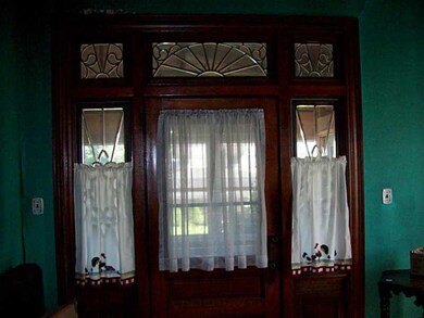 Entry/Foyer. Magnificent woodwork surrounds these 