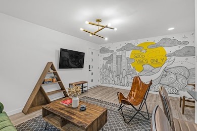 Living area with a chandelier, wood finished floo
