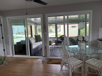 LOOKING OUT TO SUNROOM