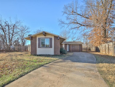 View of front facade featuring driveway, an attach
