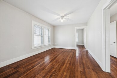 Living room with lovely hardwood floors and natura