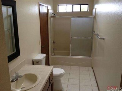 Bathroom is accessible off the master and the hall