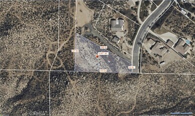 1.05 acres, easement access from paved city street with utilities nearby.