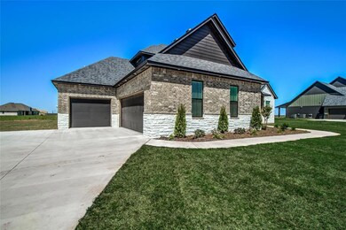 View of front of home featuring a garage and a fro
