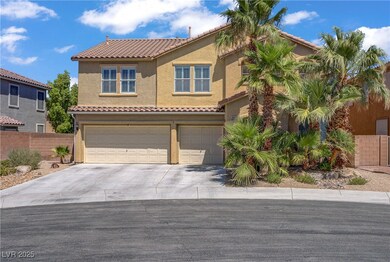 Mediterranean / spanish-style house with a garage, driveway, stucco siding, and a tiled roof