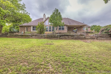 Back of house with view of pond facing East.