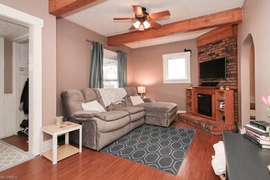 Stylish beams and plenty of natural light in the family room