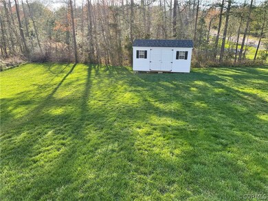 Spacious Backyard with Detached Storage Shed.