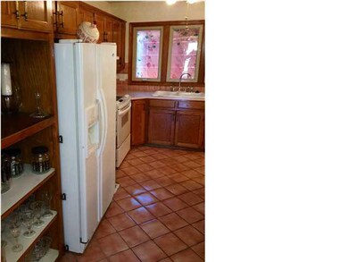 Large kitchen with built in shelves.