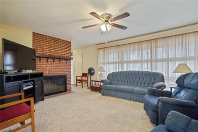 Huge Great room with brick Wood burning fireplace.