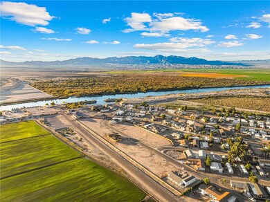 Aerial perspective of suburban area featuring a water and mountain view