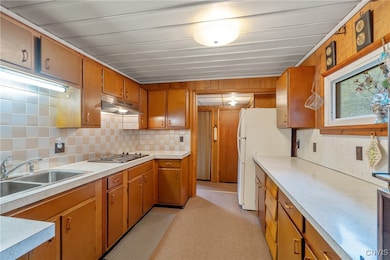 Here, we enter the kitchen. Abundant prep space is ready to enjoy with lots of counter area, not the be overshadowed by the copious amount of cabinet storage found here.
